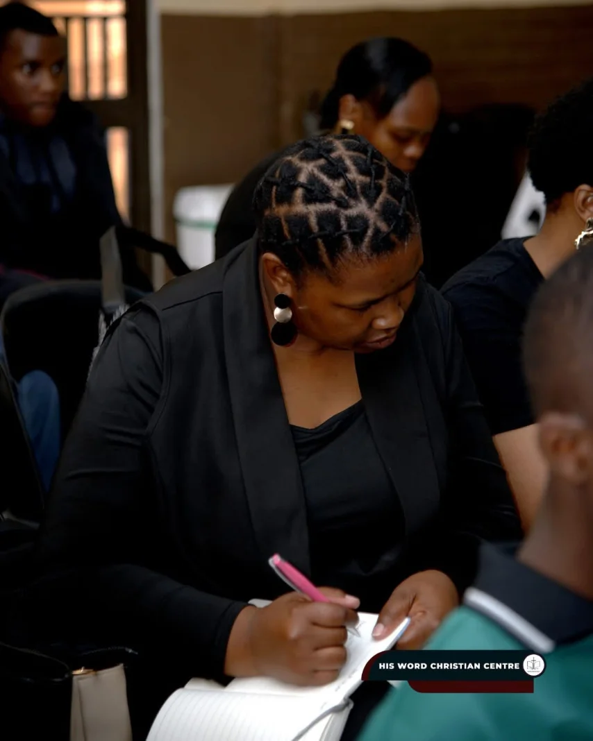 A congregant taking notes during a service