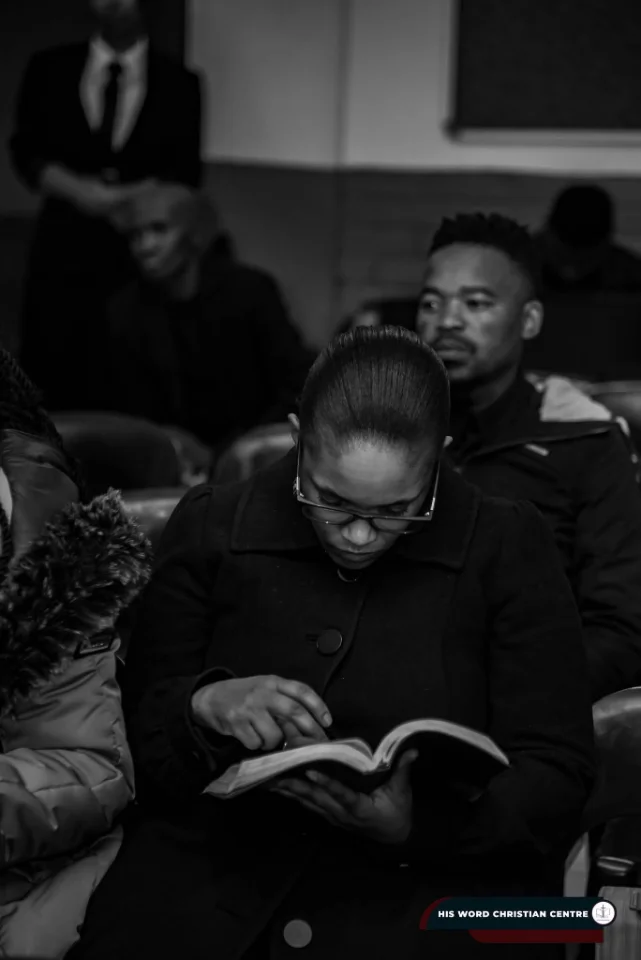 A congregant reading her Bible during a service